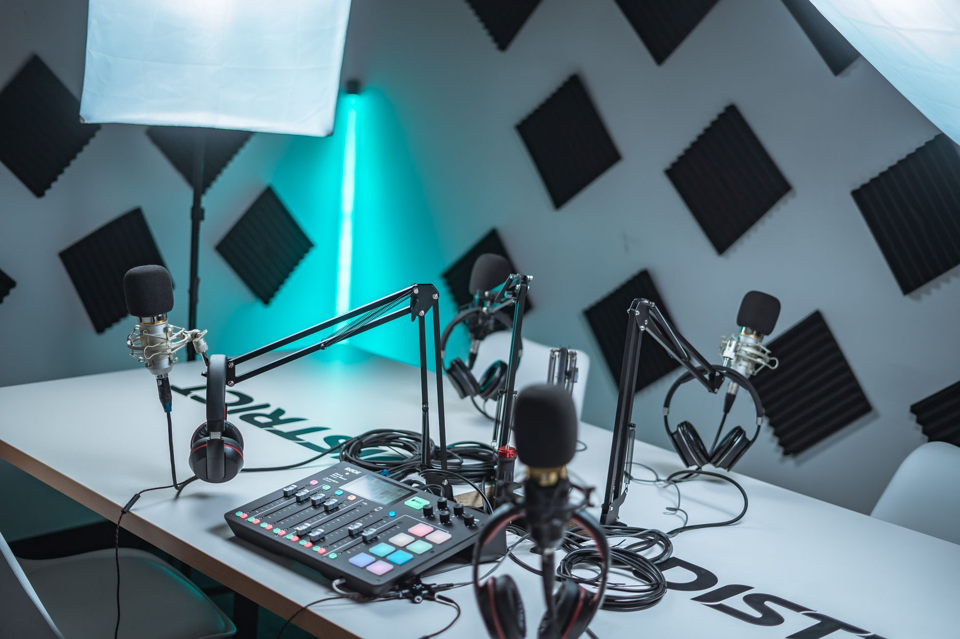 A prepared audio studio with microphones and recording controls